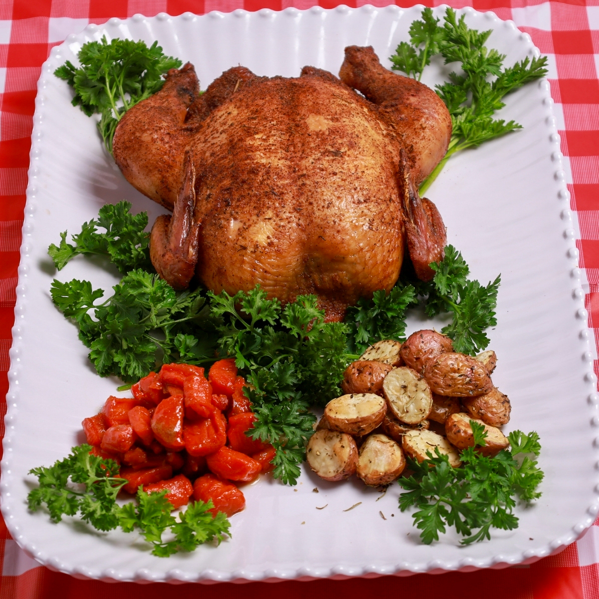 Golden-brown smoked whole chicken with crispy skin