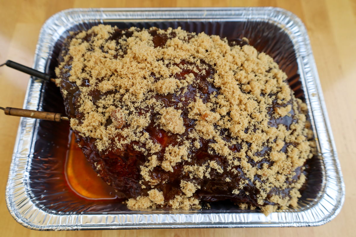 Juicy Boston butt off the smoker, prepared with honey and brown sugar for the final wrap and rest.  