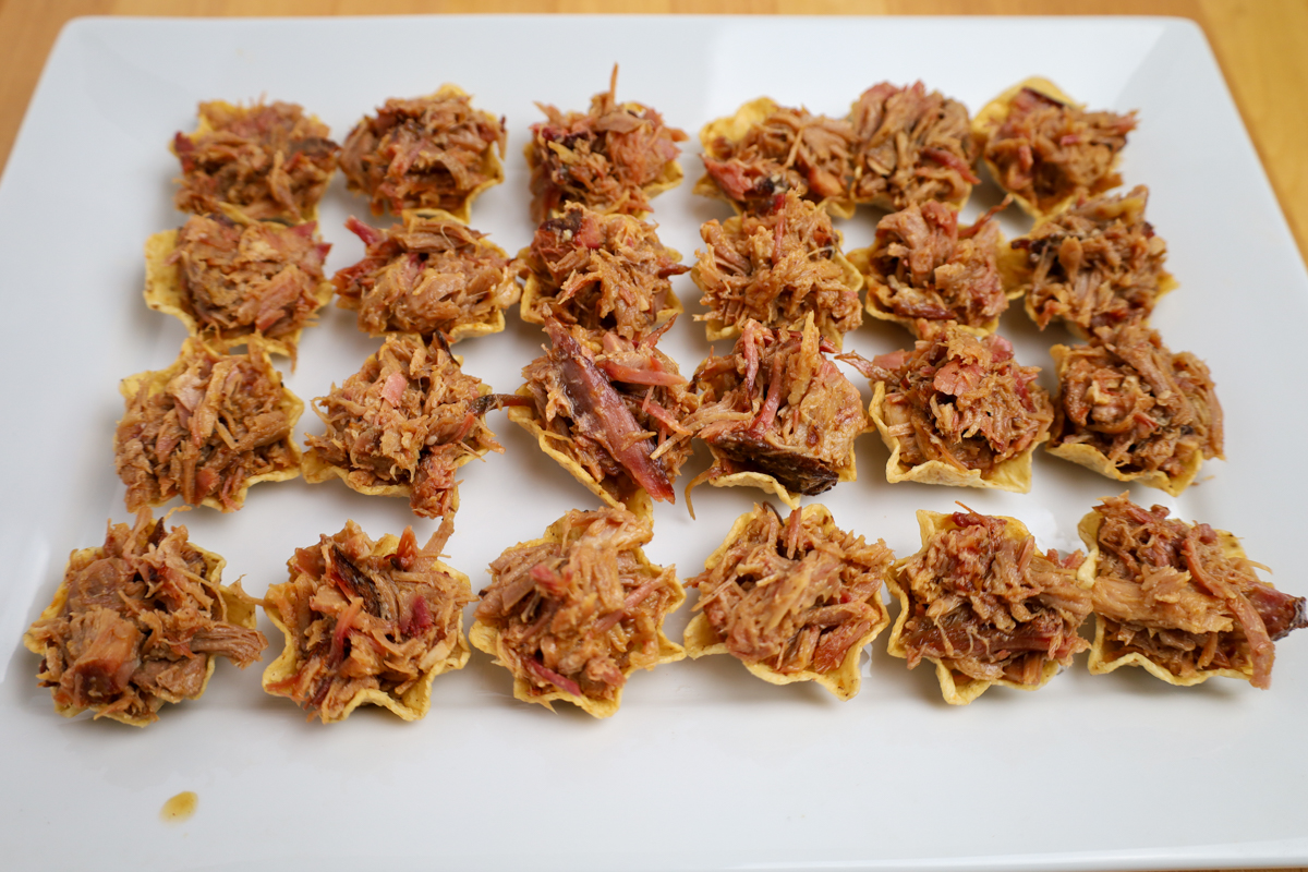 Corn chips topped with pulled pork. 