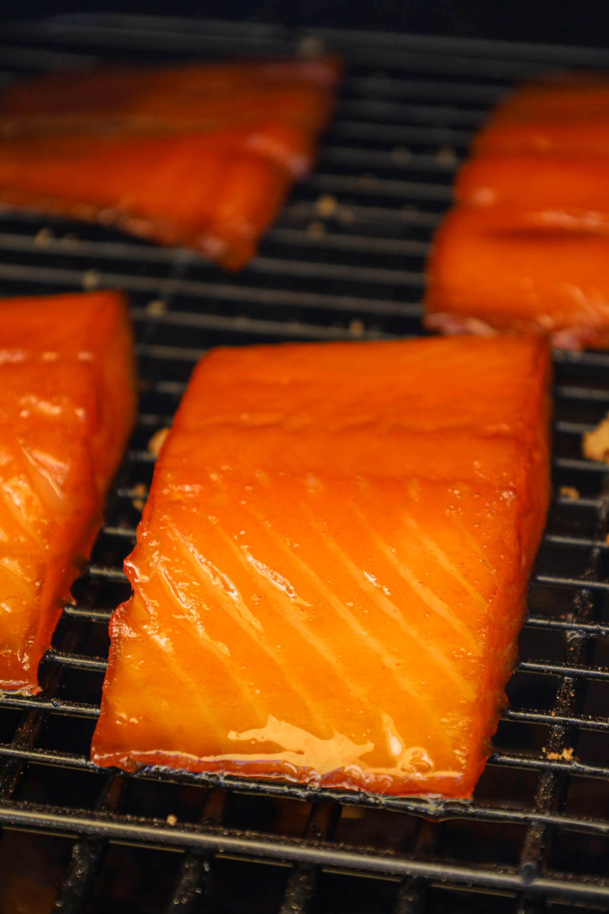 A beautiful golden glazed salmon in the smoker.